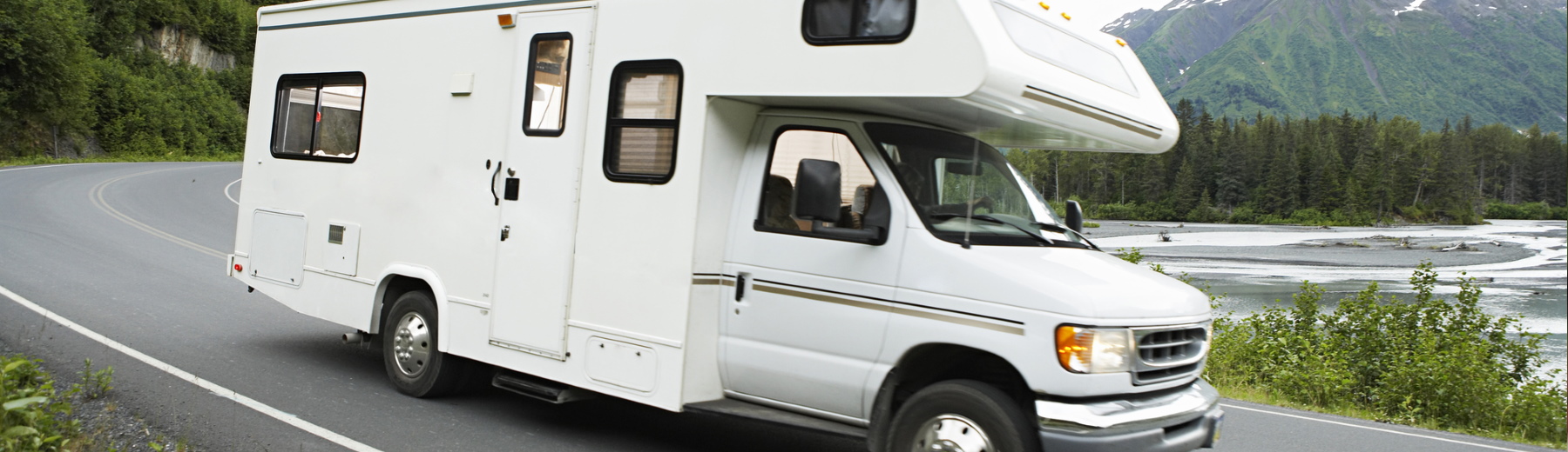 recreational vehicle traveling down road